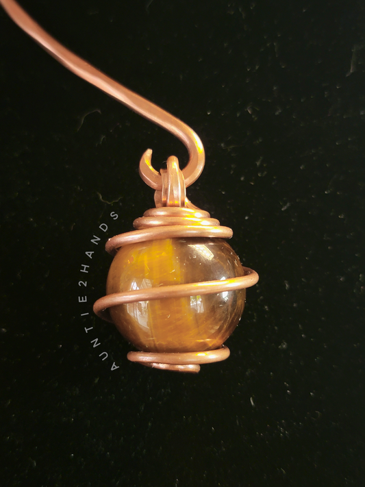 Tigers eye wrapped in Copper